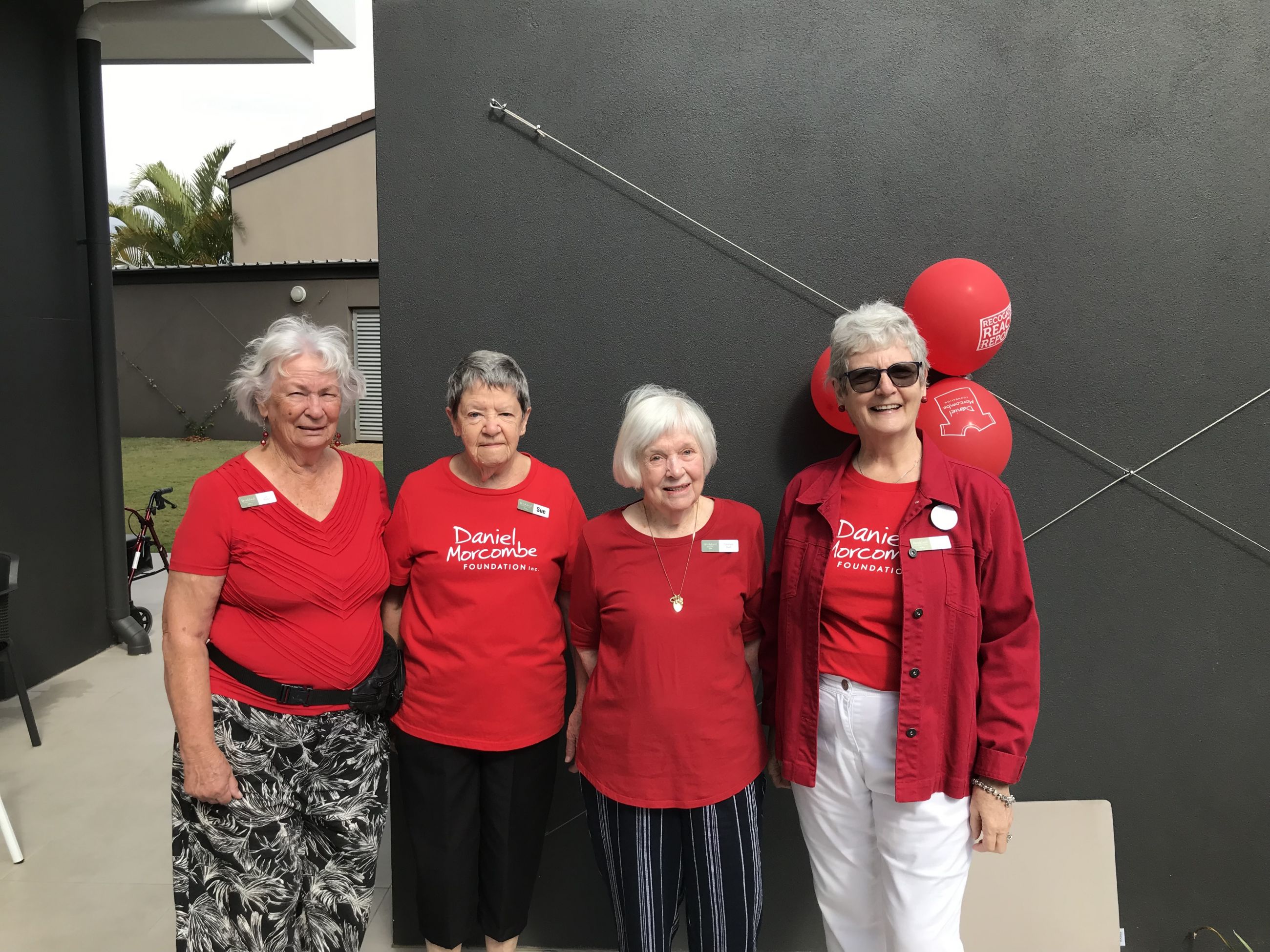 Four Brookland residents wearing red at the Day for Daniel.